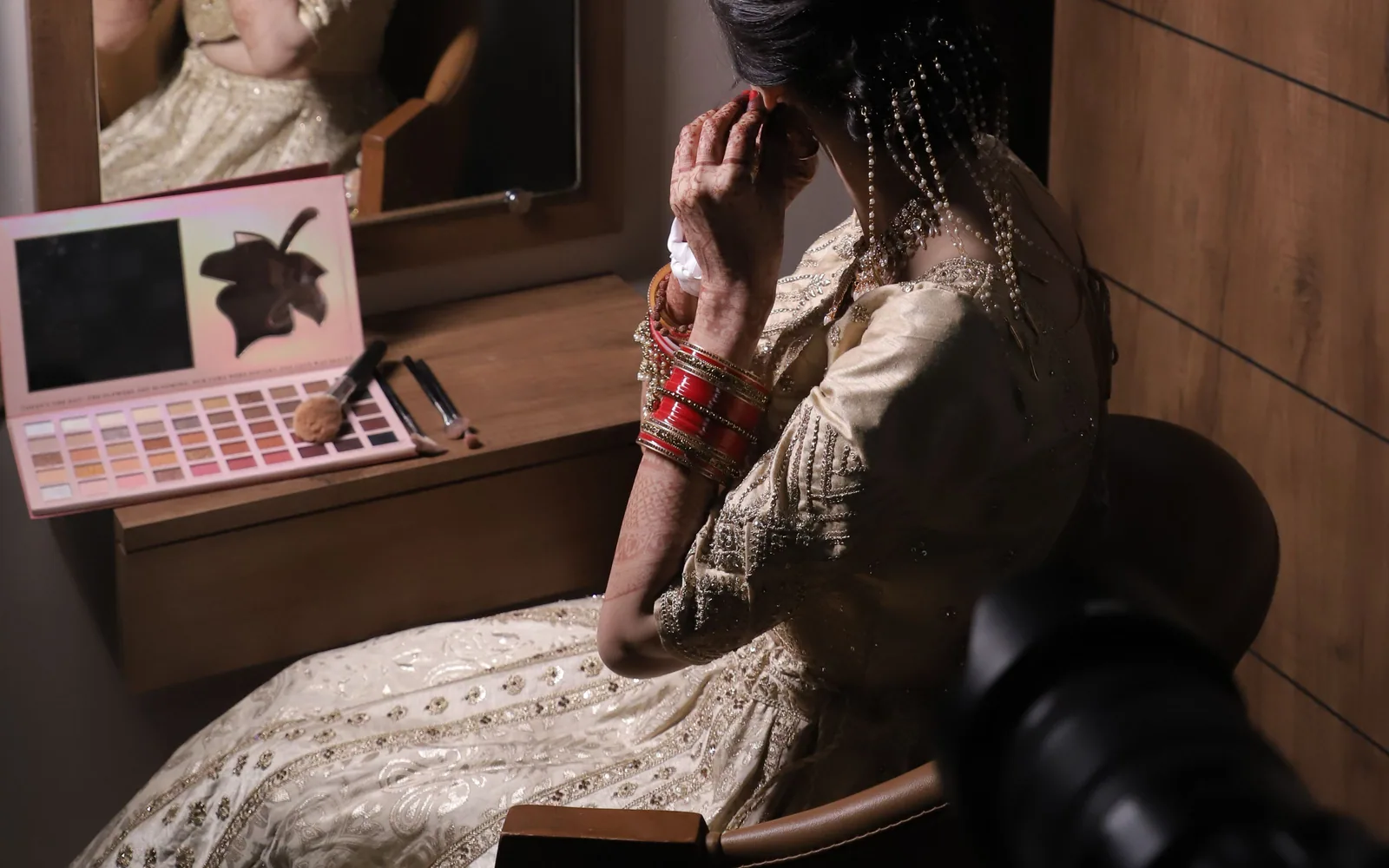 Interior of Brijal's — The Bridal Studio in Nikol, Ahmedabad, showing the styling chair, mirror and lighting
