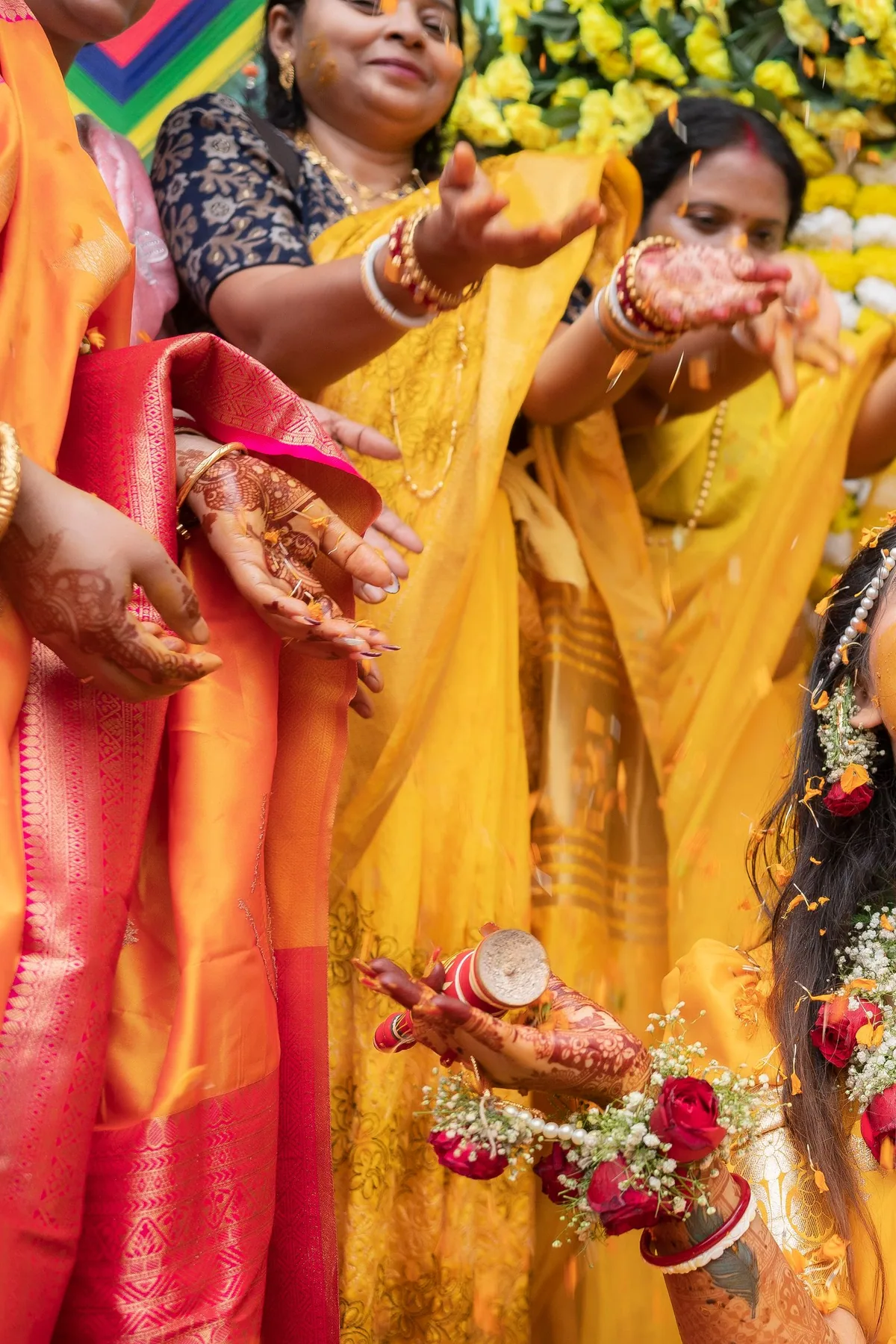 Full haldi styling including floral hair accessories and yellow outfit draping